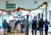 a group of people walking through an airport