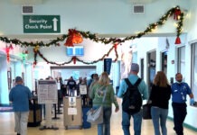 a group of people walking through an airport