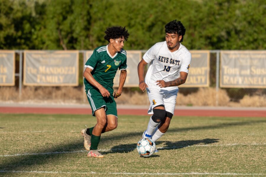 a couple of men playing a game of soccer