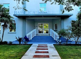 a blue building with steps leading up to it