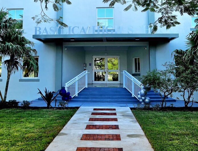 a blue building with steps leading up to it