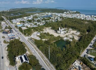 TAVERNIER PROJECT GARNERED PLENTY OF ATTENTION IN THE UPPER KEYS THROUGHOUT 2024 an aerial view of a city with lots of traffic