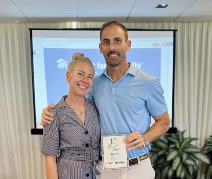 a man and a woman standing next to each other