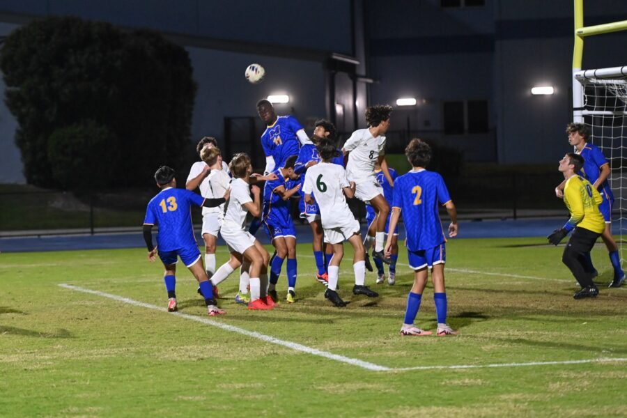 a group of young men playing a game of soccer