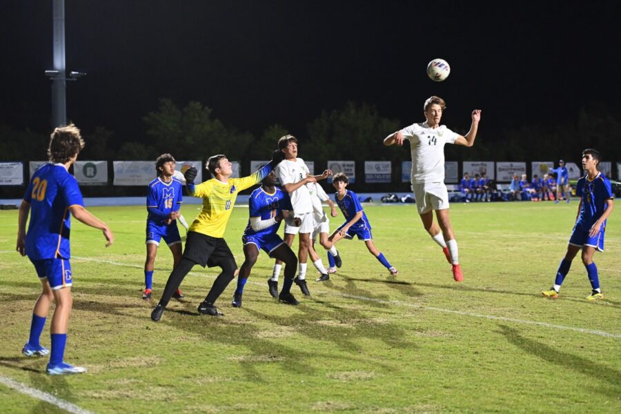 a group of young men playing a game of soccer