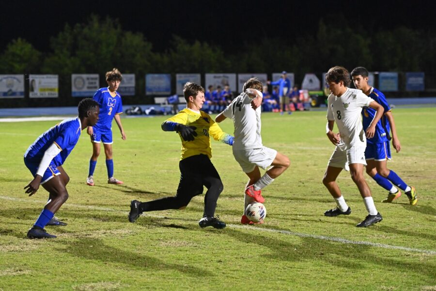 a group of young men playing a game of soccer