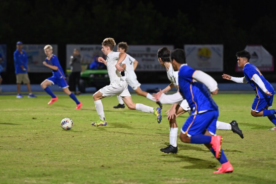 a group of young men playing a game of soccer