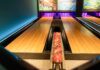 a bowling alley with bowling pins and bowling balls