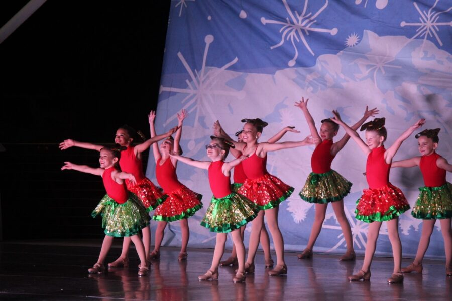 a group of young girls dancing on a stage