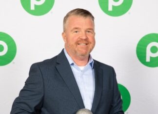 a man in a suit holding a silver ball