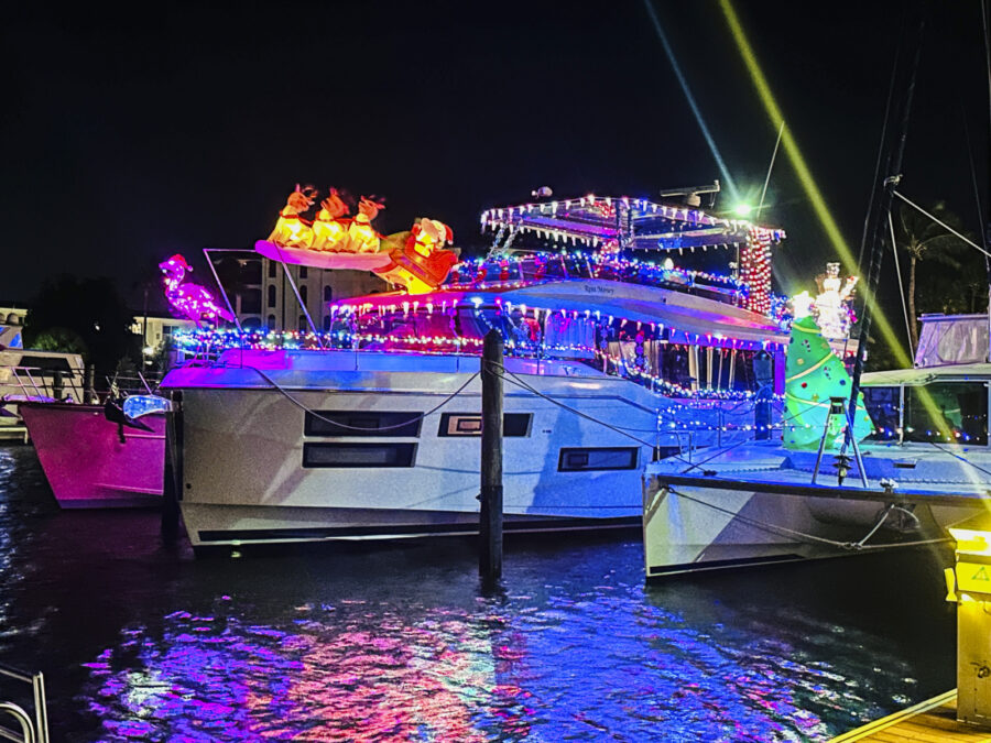 a boat is lit up with christmas lights