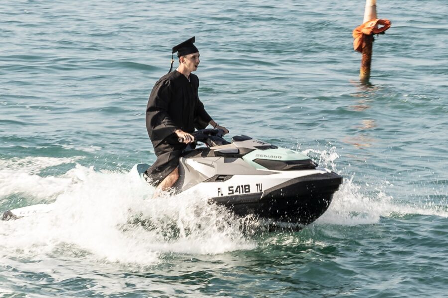 a man riding a jet ski across a body of water