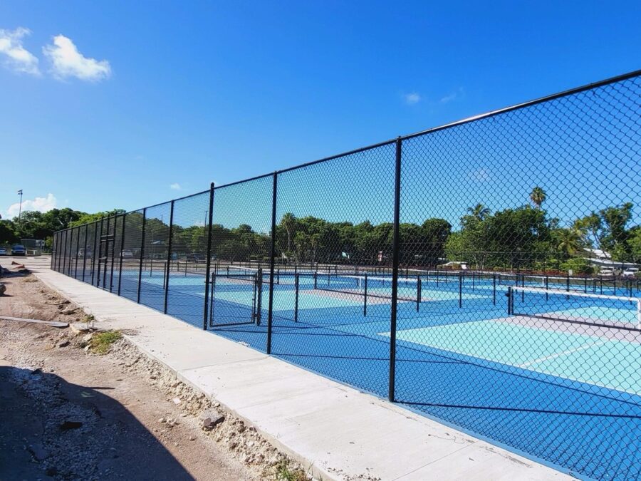 a tennis court with a fence surrounding it