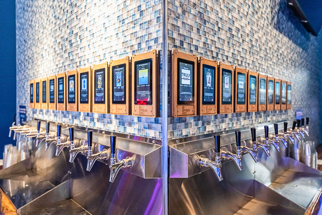 a row of urinals in a public restroom