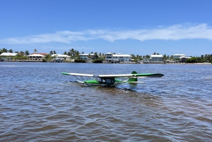 a small plane floating on top of a body of water