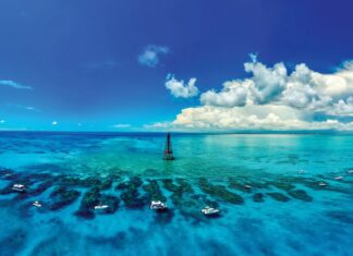 a boat floating on top of a large body of water