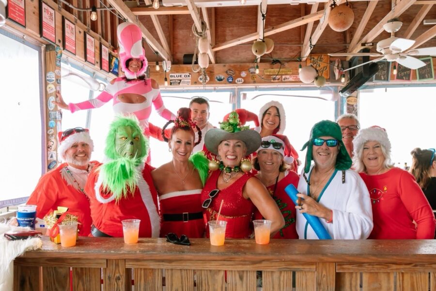 a group of people standing around a bar