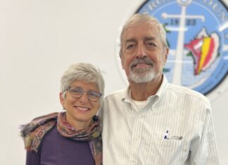 a man and a woman standing next to each other