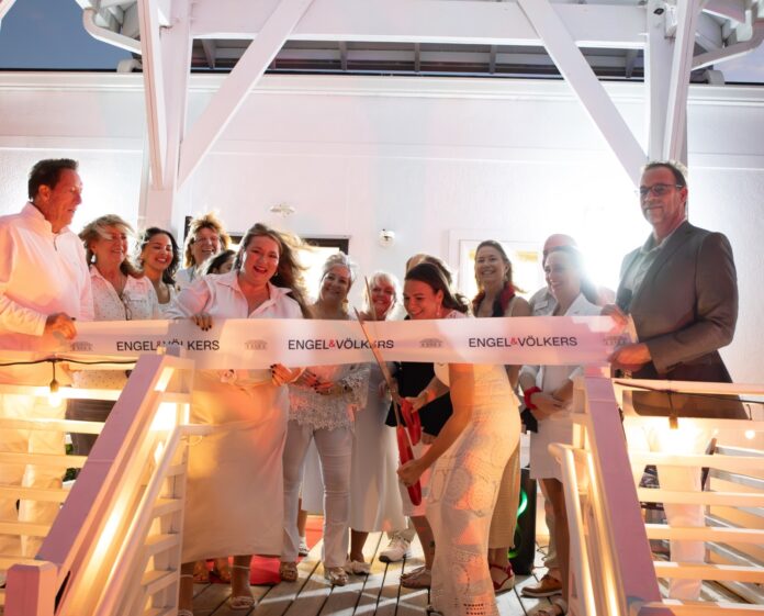 a group of people standing on top of a bridge