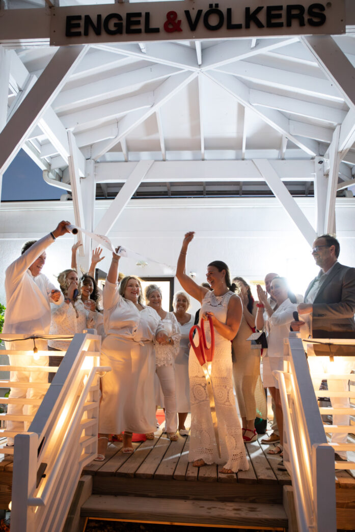 a group of people standing on top of a bridge