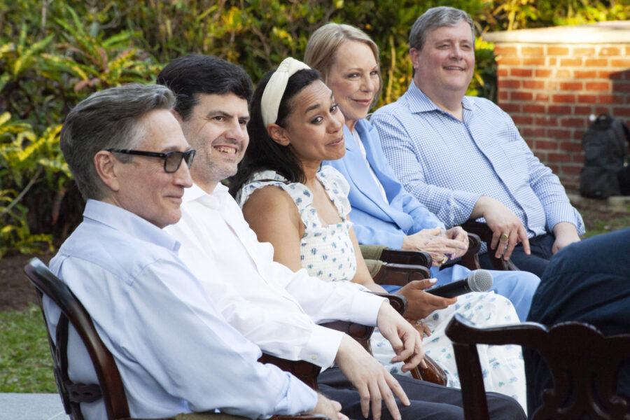 a group of people sitting next to each other