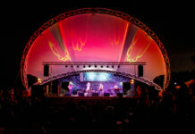 a stage with a band on it at night