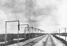 a black and white photo of a train track