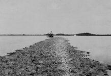 a boat traveling across a large body of water