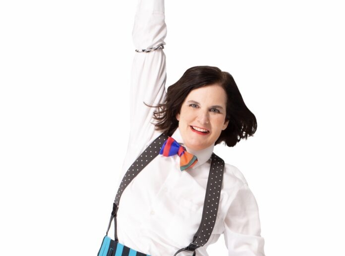 a woman with a bow tie and suspenders