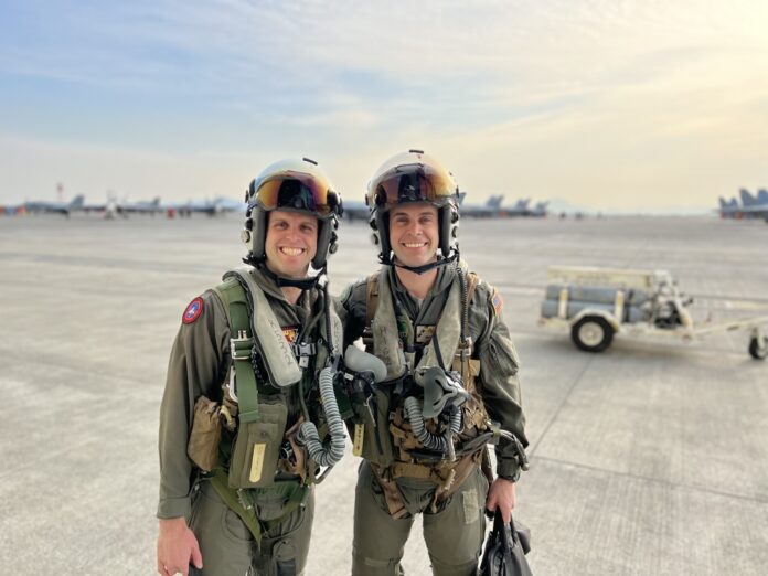 two women in military gear posing for a picture