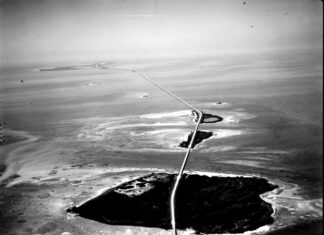 a black and white photo of an aerial view of a road