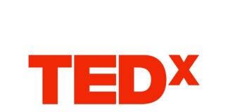 a red tedx logo on a white background