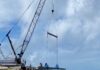 a crane on a boat in the ocean