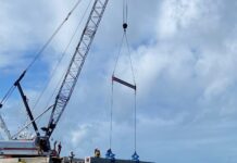 a crane on a boat in the ocean