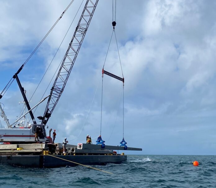 a crane on a boat in the ocean