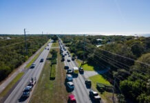 an aerial view of a highway with many cars on it