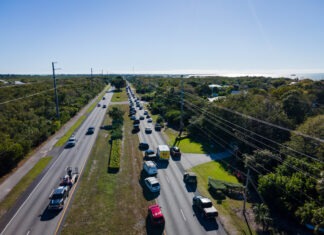 an aerial view of a highway with many cars on it