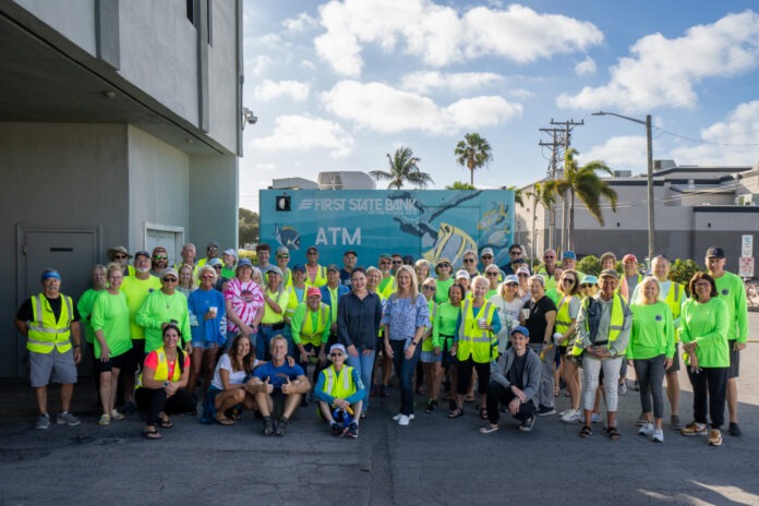 DSC06487 a group of people in neon vests posing for a picture