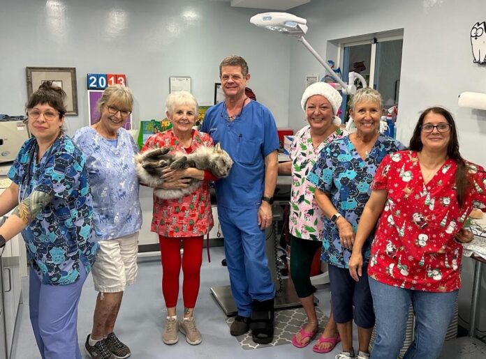 a group of people in scrubs standing in a room