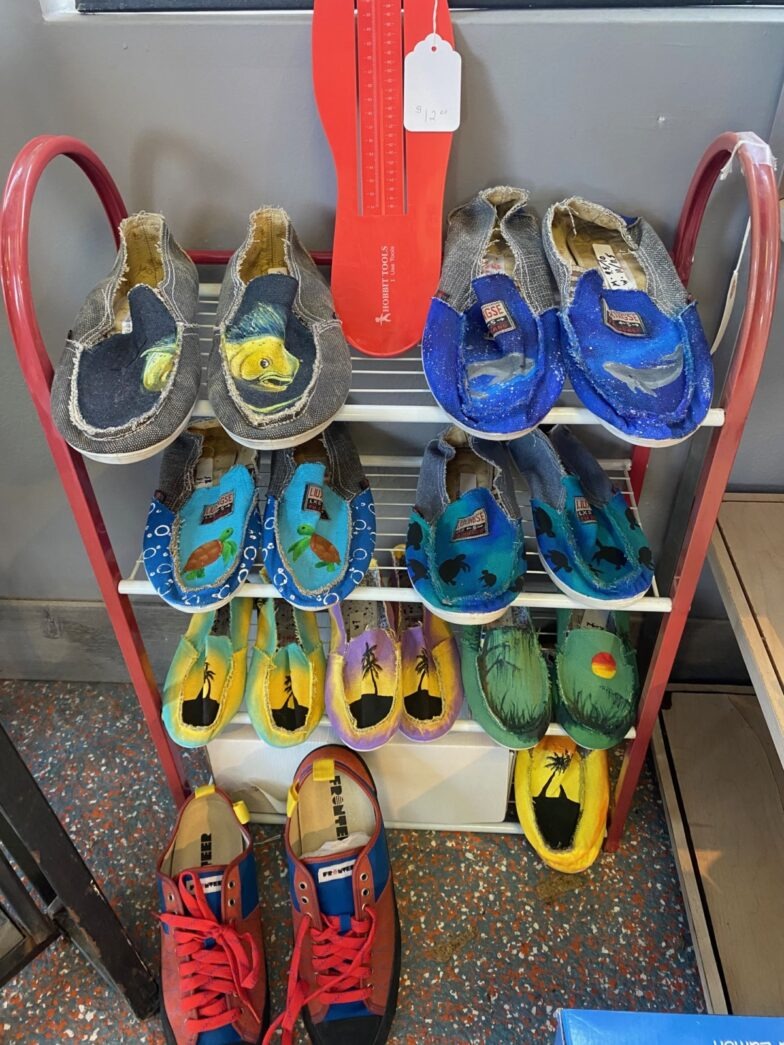 several pairs of shoes are on a rack