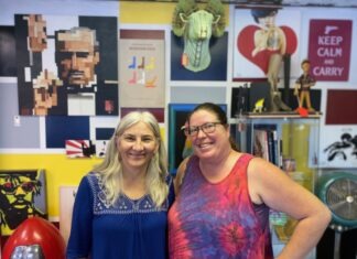 a couple of women standing next to each other