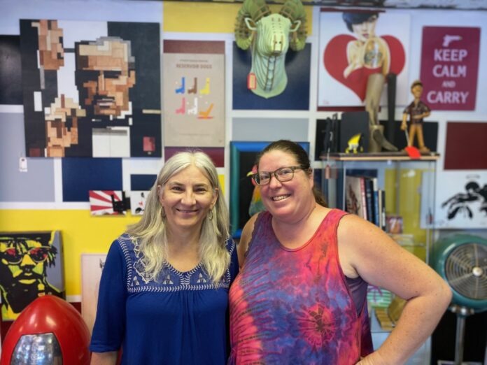 a couple of women standing next to each other