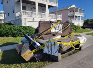 a pile of junk sitting on the side of a road