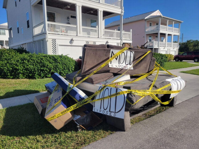 a pile of junk sitting on the side of a road