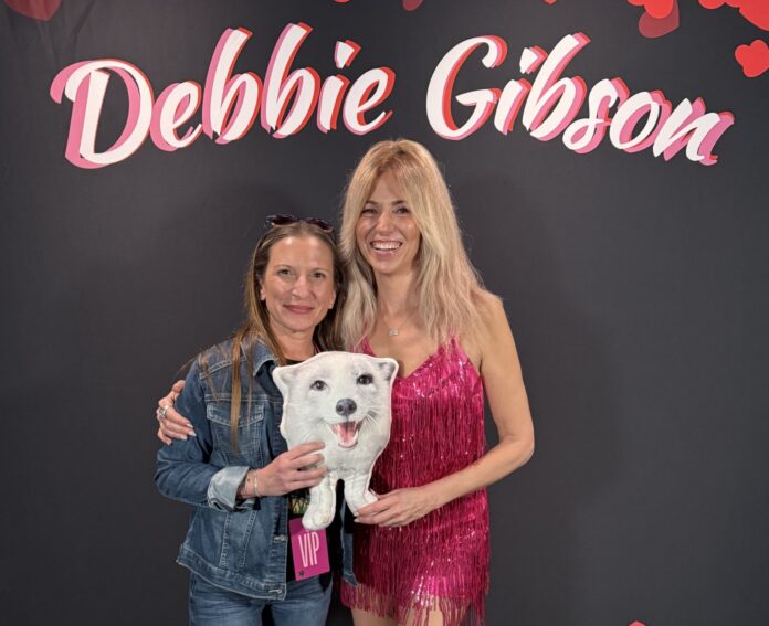 a couple of women standing next to each other