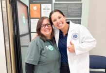 a couple of women standing next to each other