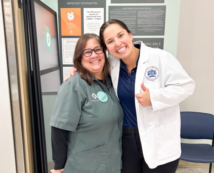 a couple of women standing next to each other