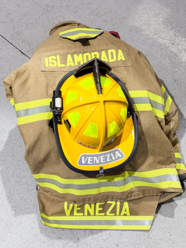 a fireman's helmet sitting on the ground