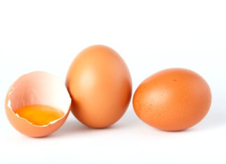 three eggs with an egg yolk in them