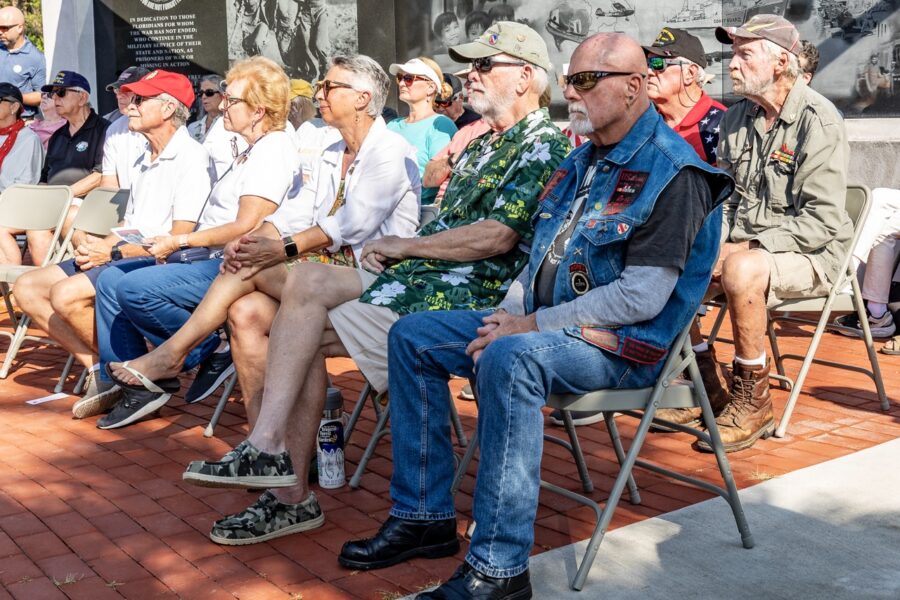a group of people sitting on top of a bench